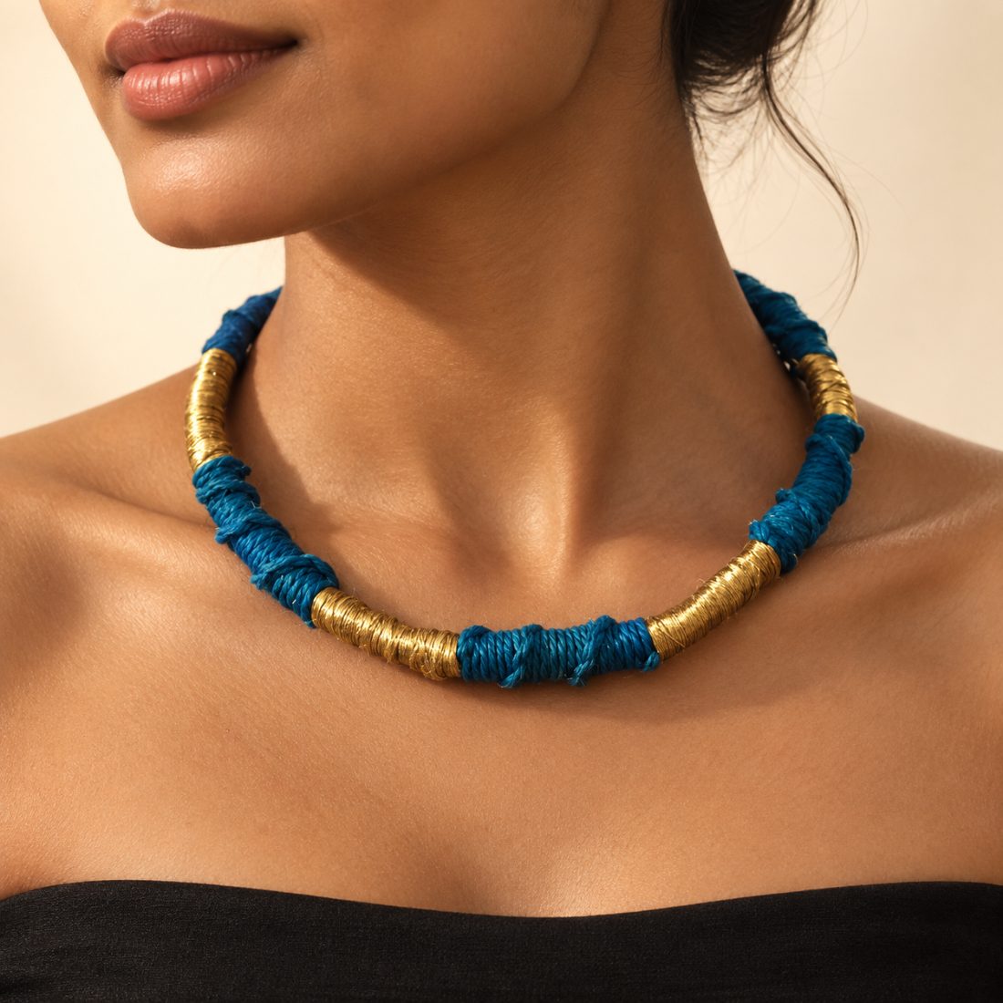 Keamari — indigo net cord and brass wire wrapped in alternating bands over a salvaged steel hoop.