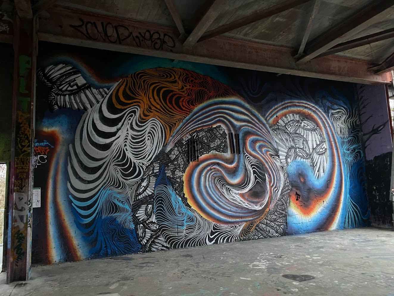 a whole wall of swirl, under a concrete ceiling nobody maintains.