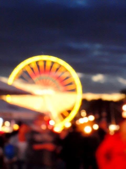 the wheel, out of focus — the crowd was the picture.
