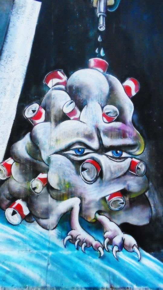 a creature built out of crushed cans, blue-eyed, clawed, crouched under a dripping tap. consumption drawn as an animal that has grown a face and is now waiting for water. painted where the recycling actually piles up.