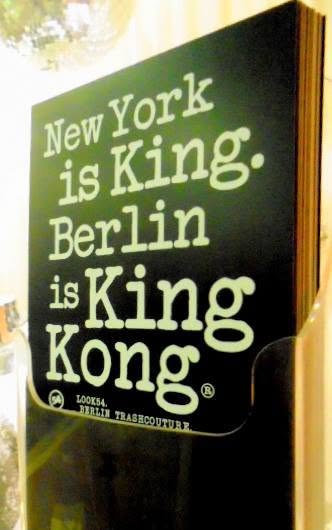 a trashcouture sign in a shop window. new york is monarchy. berlin is the ape that climbs the building and won&rsquo;t come down &mdash; the only city that brags about being the wrong one.