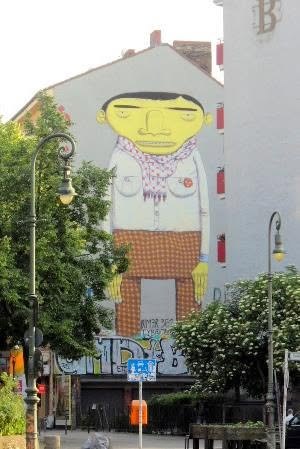 os g&ecirc;meos painted this six-storey yellow giant off schlesische stra&szlig;e. the brazilian twins say the yellow men come out of a dream they share. they wrapped him in a keffiyeh and set him down in a turkish kiez &mdash; a foreigner standing guard over the street that housed him.