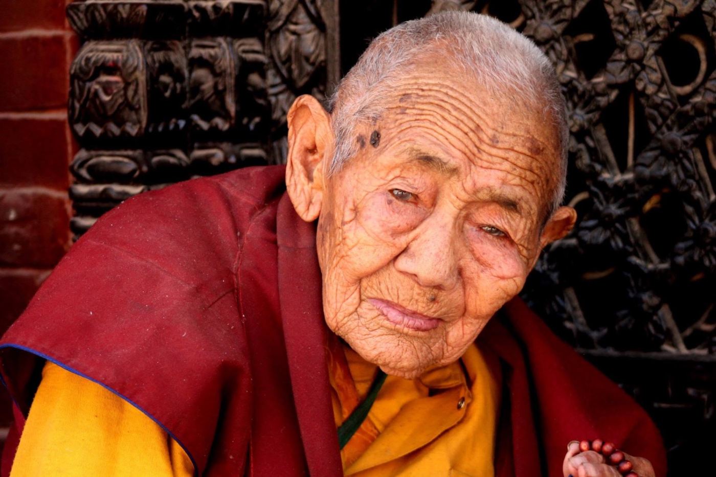 an old nun in the temple doorway. she let me stay for one frame.