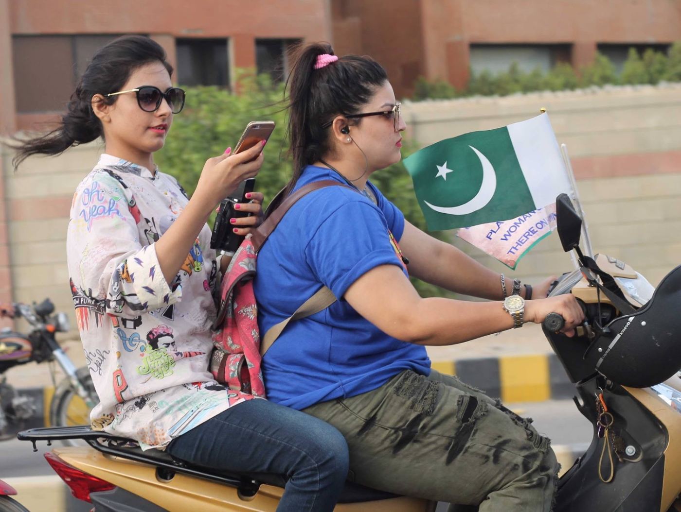two on one scooter, the flag riding third.