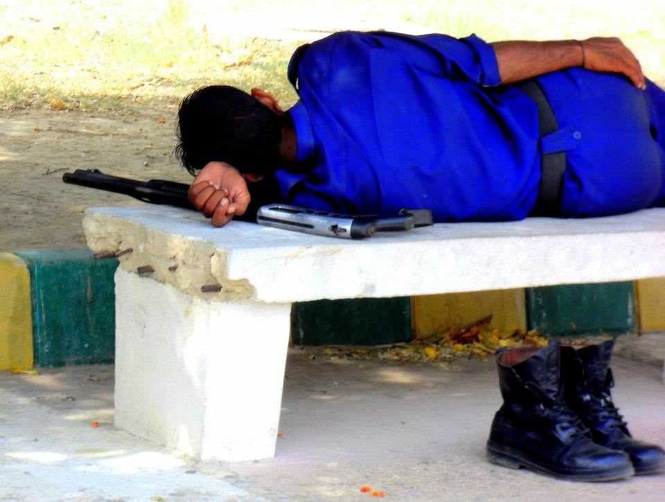 the guard, asleep on the bench in the afternoon. rifle beside his head, pistol by his hand, boots on the ground. nobody woke him.