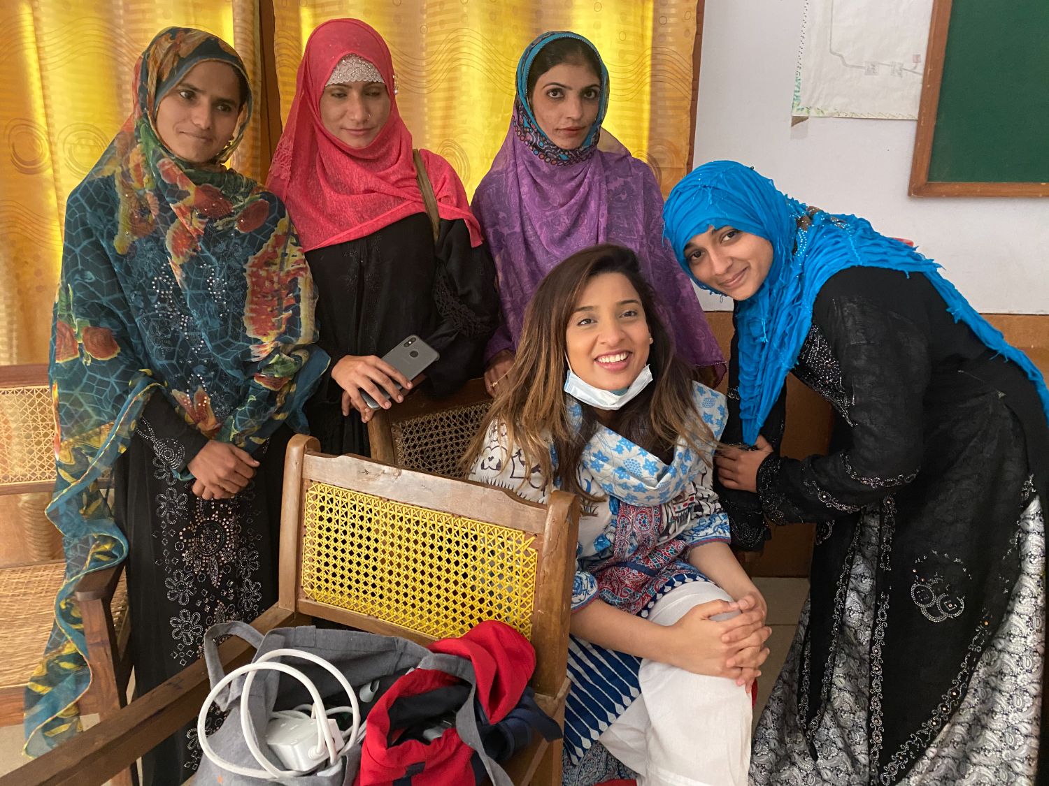 Saba laughing with a room of trainees in Jamshoro