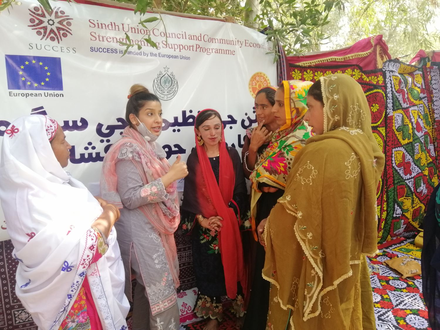 An open-air workshop under a shelter in Kambar Shahdadkot