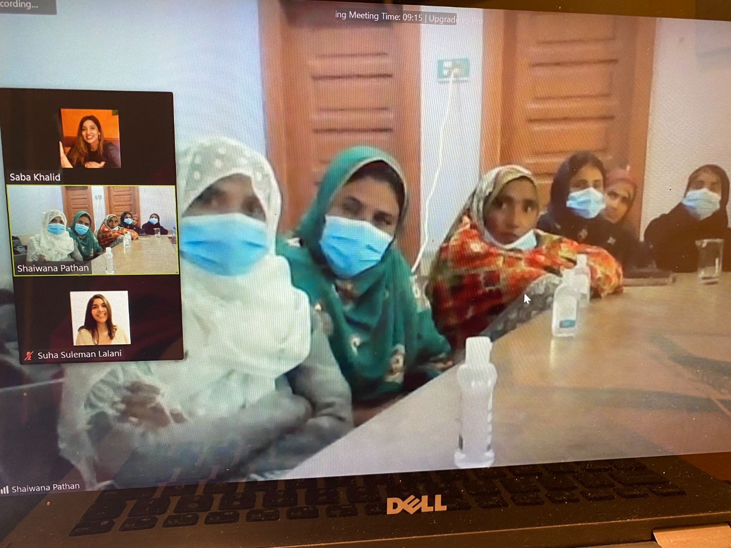 A group of masked women crowding into a Zoom call tile