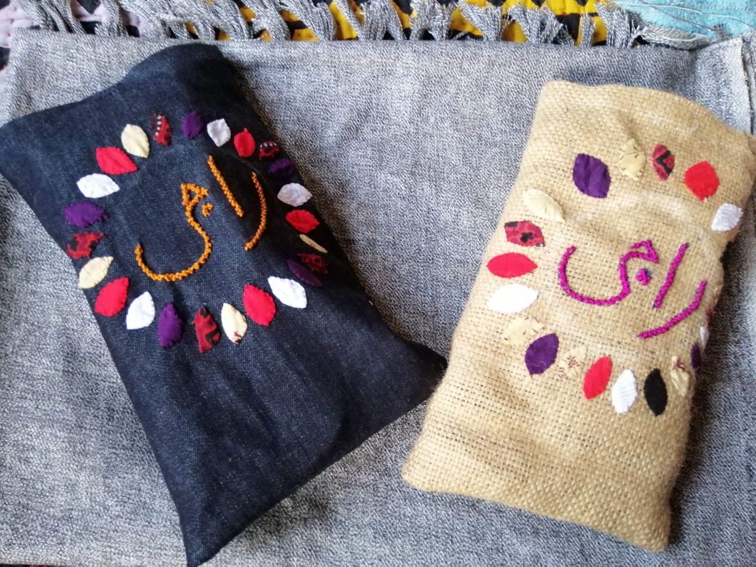 Raaji pouches hand-embroidered in Urdu script