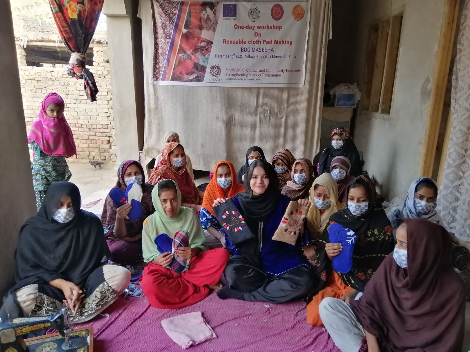 A group in Sukkur holding up finished pads