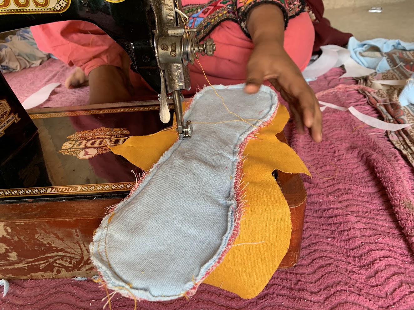 A one-day reusable cloth pad workshop under a banner